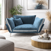 Laura fauteuil en velours bleu clair et pieds argentés