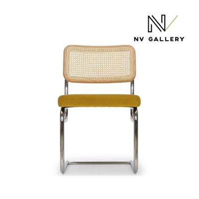 Lorenzo chaise design velours jaune moutarde, cannage et métal chromé